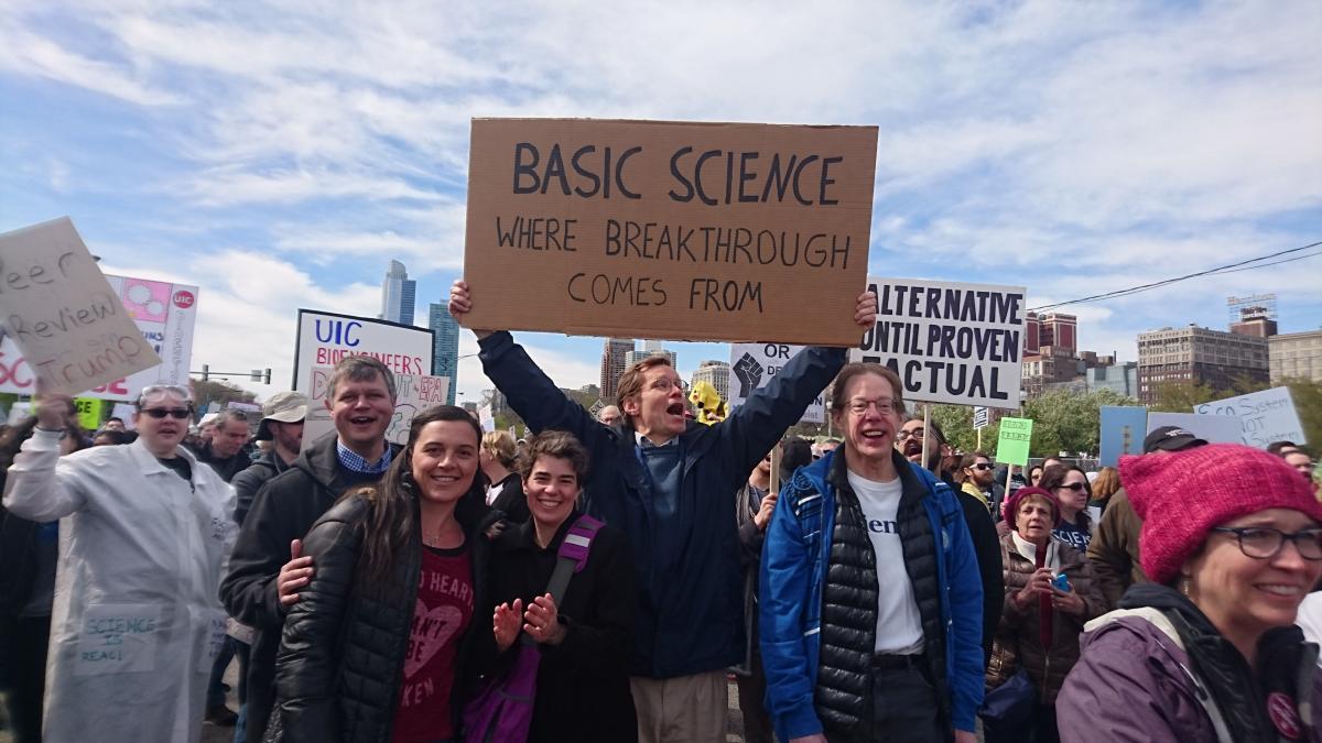 BSD Faculty post with signs at the March for Science Chicago